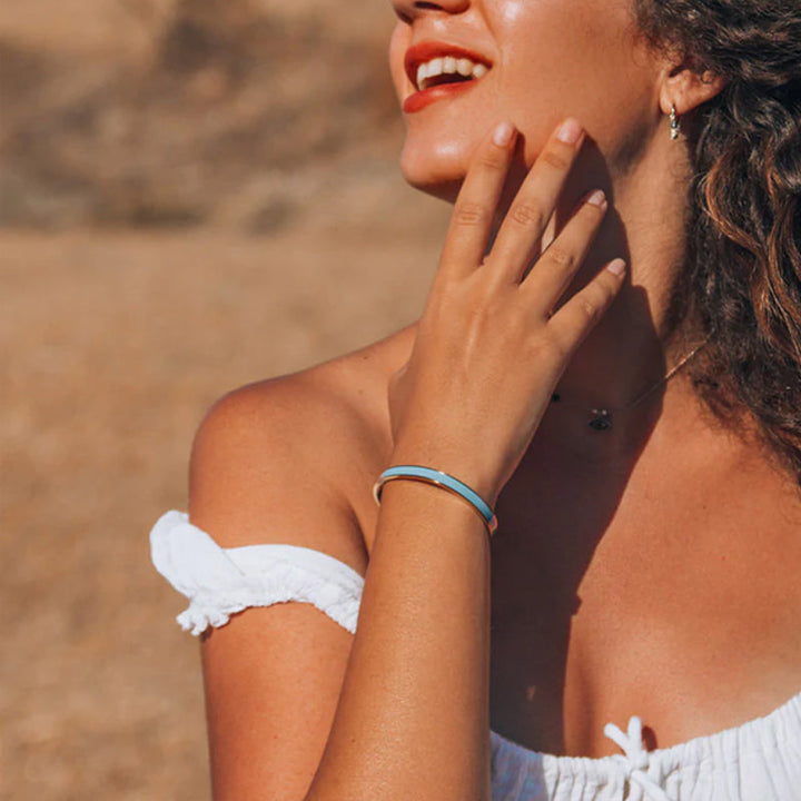 Detailed shot of a women's engraved stainless steel bangle, hypoallergenic and durable friendship gift