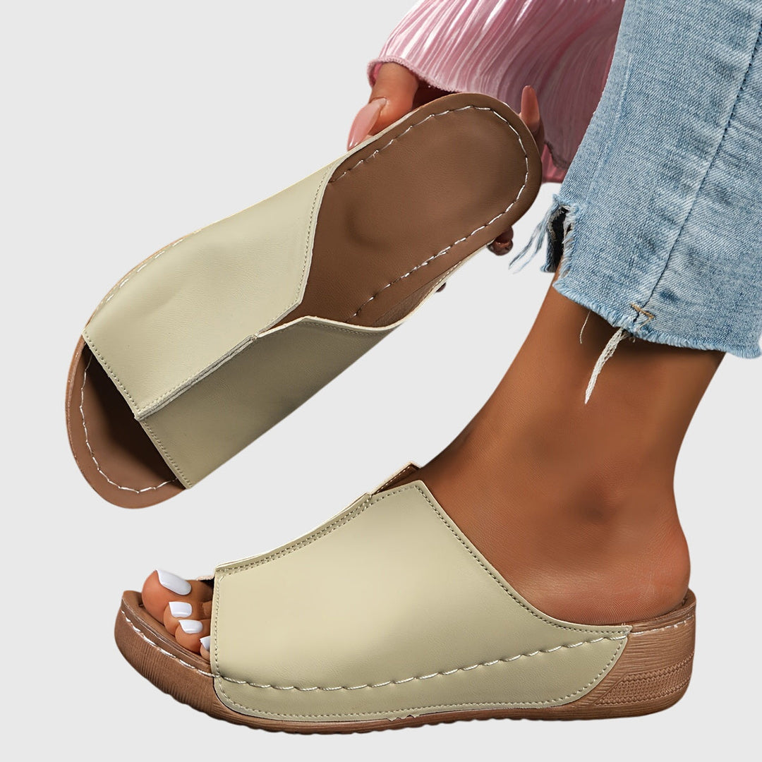 Ladies open-toe comfort sandals. Ergonomic flat design with adjustable straps for stylish & supportive summer wear.