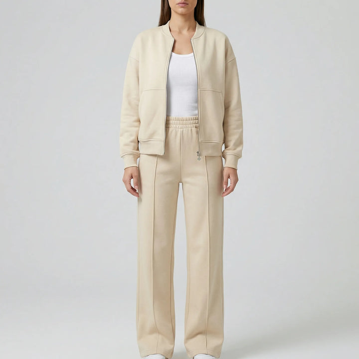 Model wears Women's Evie Regular Fit Straight Leg Trousers Set, showcasing elegant and casual style.
