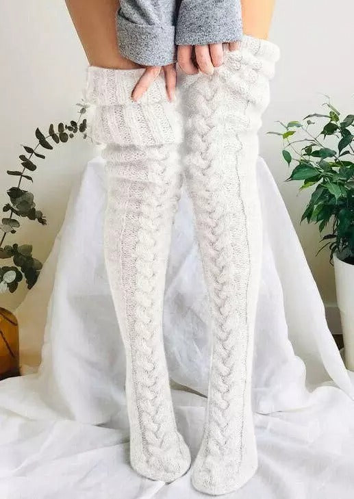 Comfortable women's over-knee socks, extra long and knitted for warmth, designed for the winter season.