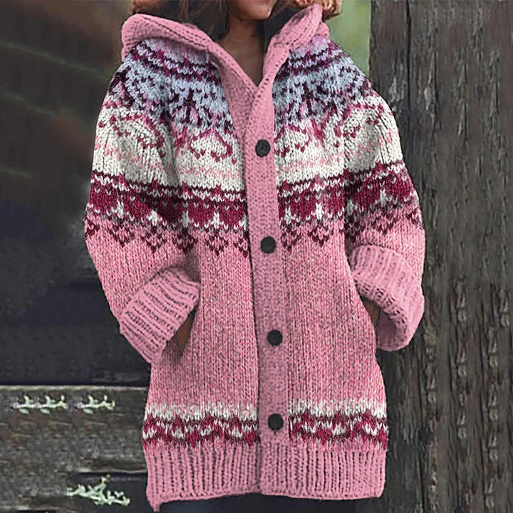 Side profile of a woman wearing a Fair Isle knit hooded cardigan, demonstrating its relaxed fit and warmth.