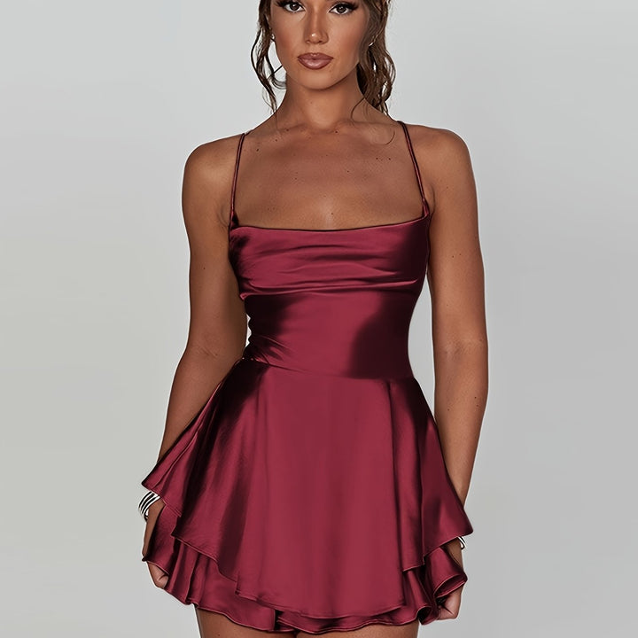 Modern women's fitted ruched mini dress with tiered skirt, perfect for any party or homecoming.