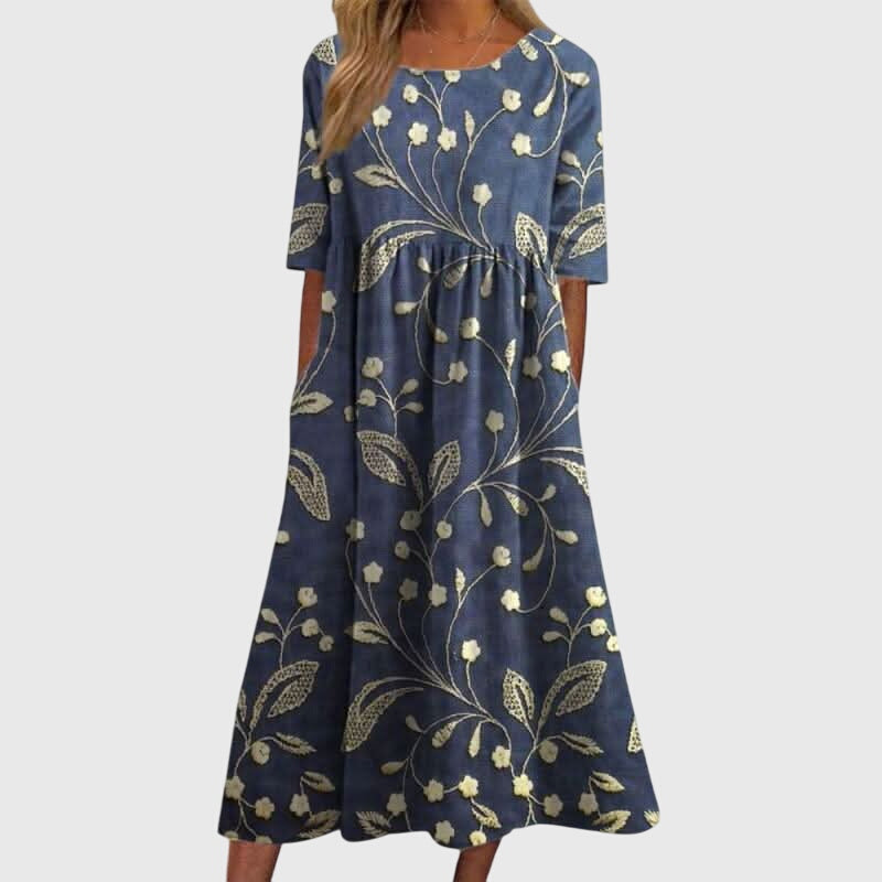Women's flattering embroidered summer dress, perfect for warm weather occasions.