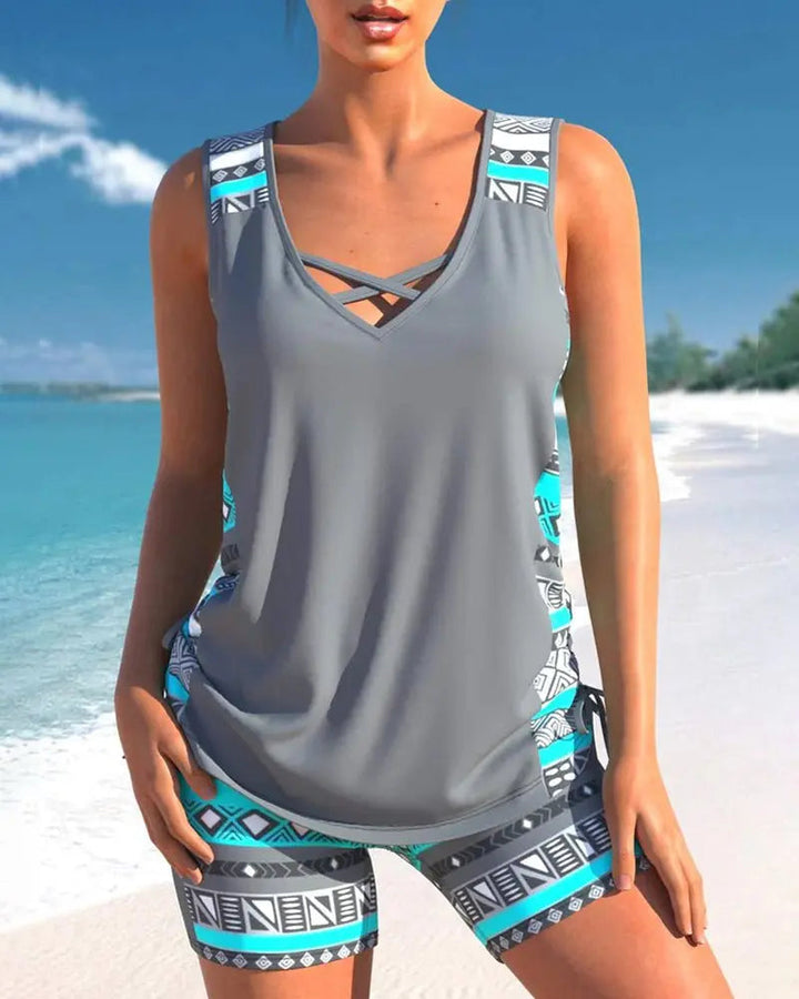 Women's flattering swim tankini top with tummy control, adjustable straps. Perfect beachwear or pool fashion.