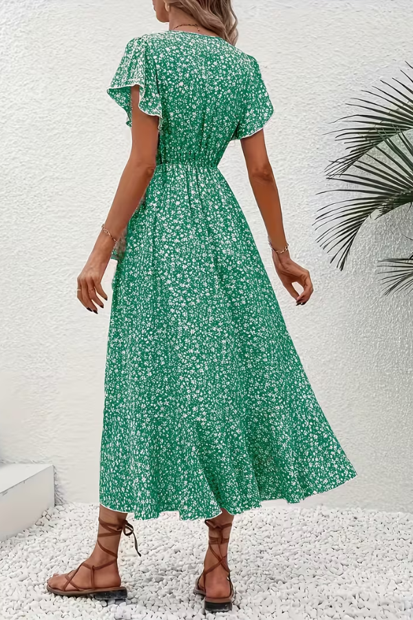 Close-up of elegant floral print on women's V-neck short sleeve dress, perfect for summer chic.