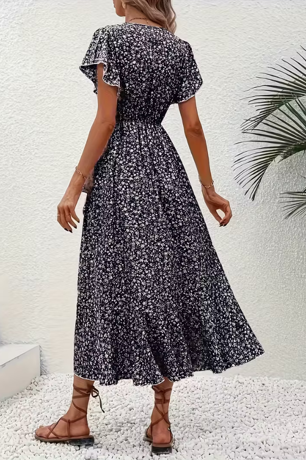 Women's elegant V-neck short sleeve dress, ideal for summer parties, offering a flattering silhouette.