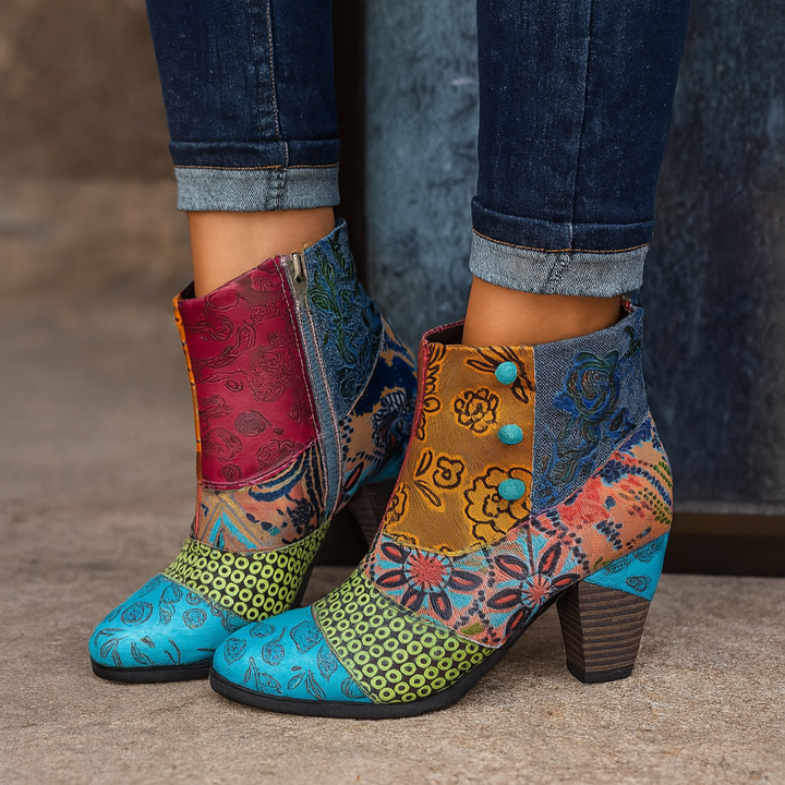 Chic women's ankle boots with bold floral pattern and sturdy block heel, perfect for casual or dressed-up looks.