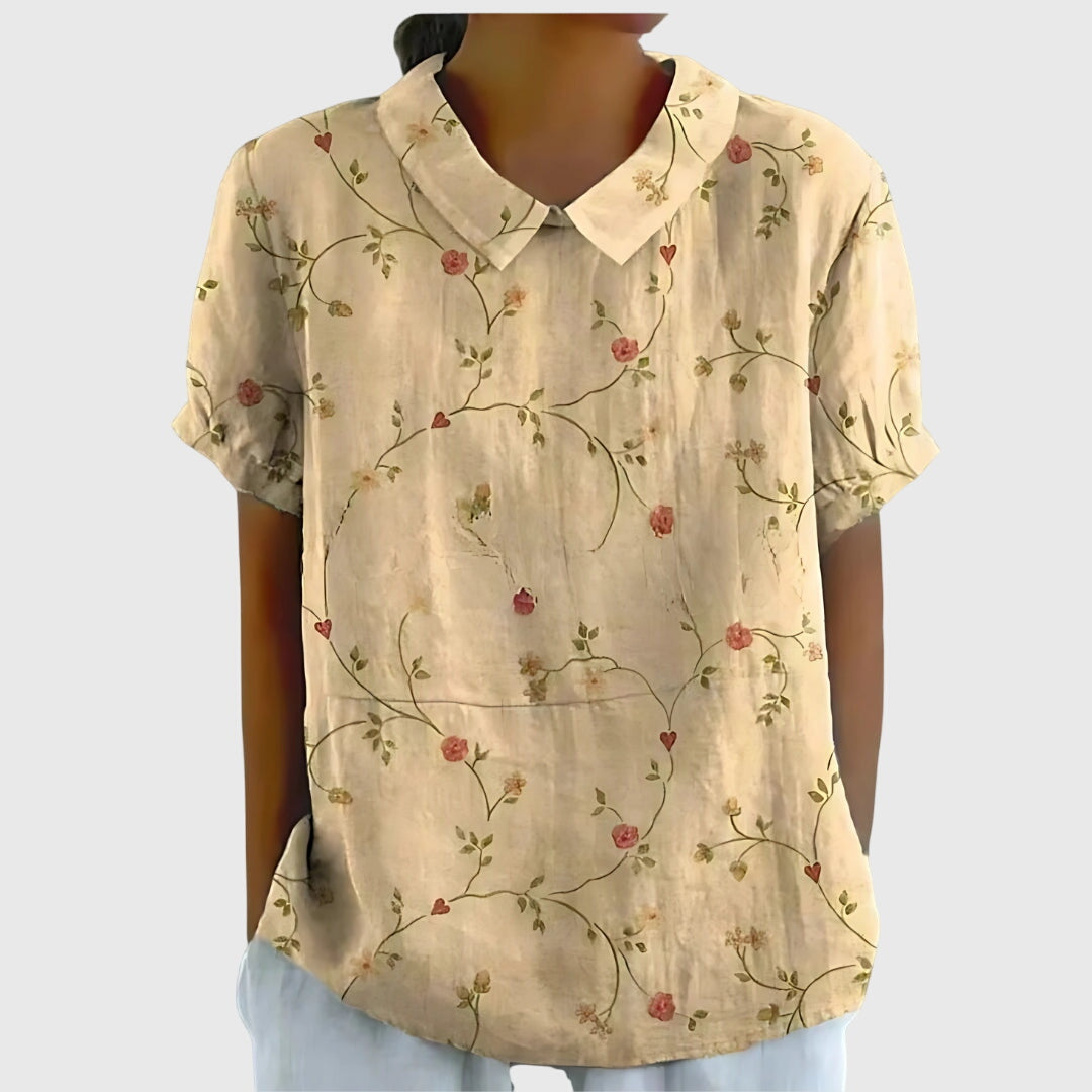 Detailed vibrant floral pattern on a comfortable women's blouse, ideal for everyday fashion.