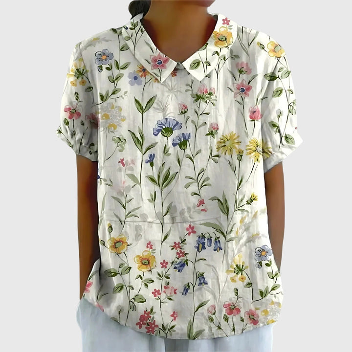 Stylish woman in a relaxed fit floral top, perfect for a casual spring day or summer outing.