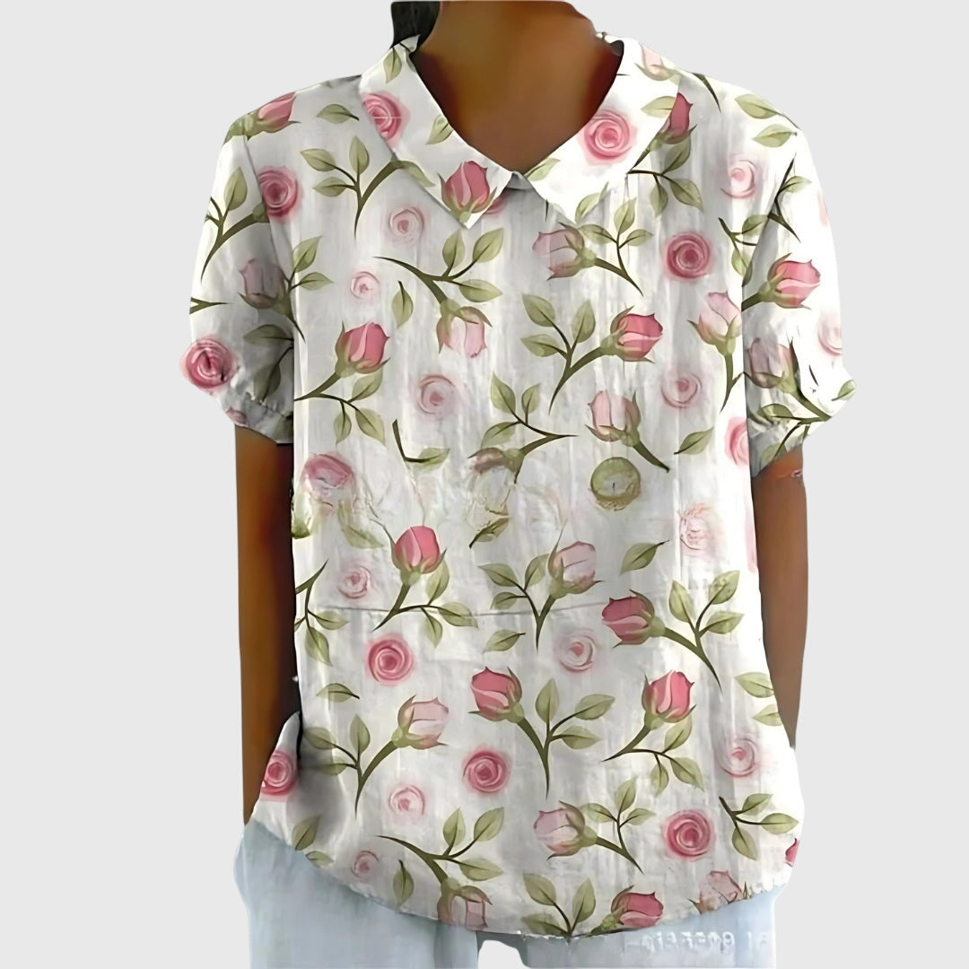 Full length front view of a women's floral blouse, a stylish & versatile spring/summer fashion top.