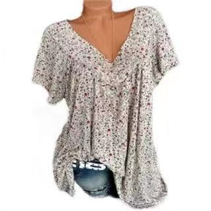 Vacation-ready women's boho blouse, featuring a beautiful floral print and flutter sleeves.