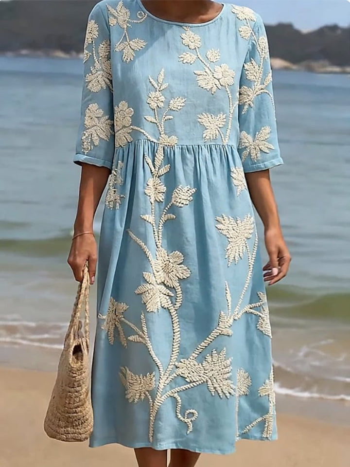 Elegant women's floral embroidered maxi dress. Ideal for spring, summer parties & vacation wear with a flowing silhouette.