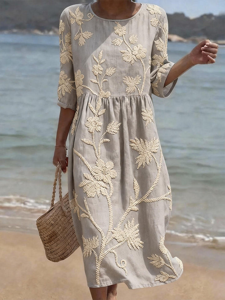 Stylish women's floral embroidered maxi dress. Flowing fit, round neck & three-quarter sleeves for comfortable summer fashion.
