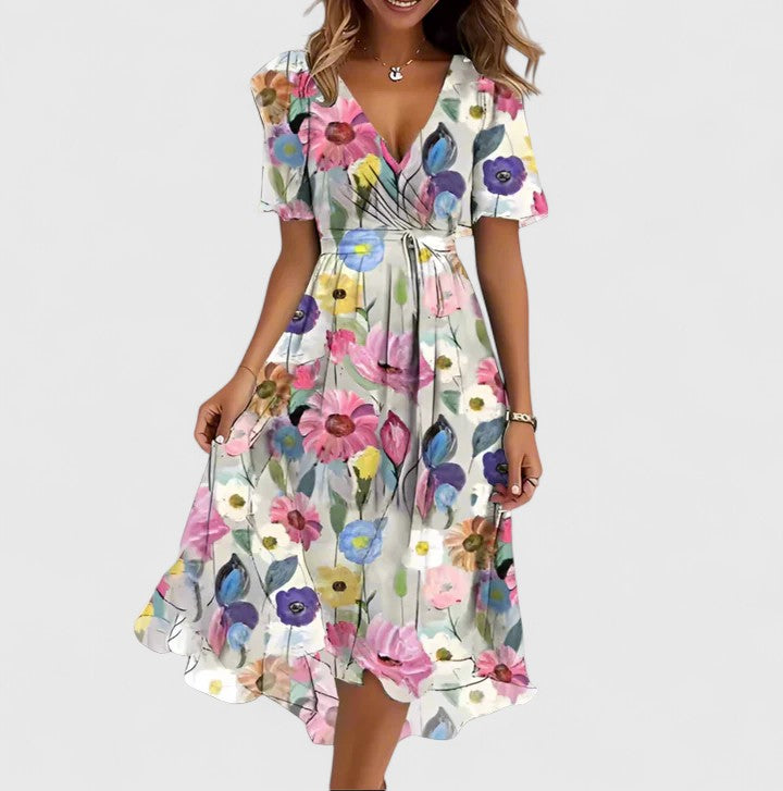 Women's V-neck floral midi dress with flutter sleeves & cinched waist. Perfect for casual spring/summer wear.