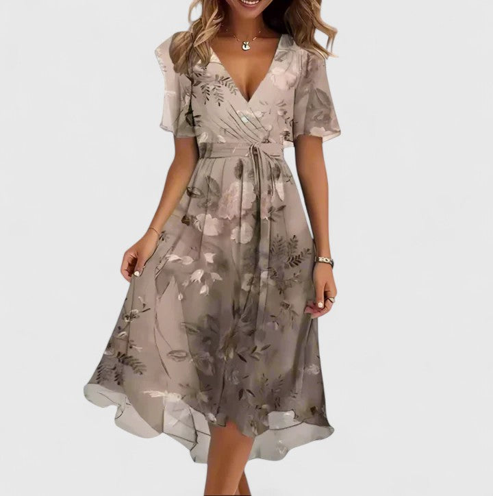 Chic women's floral print midi dress. Flutter sleeves & V-neck. Cinched waist for a flattering summer look.