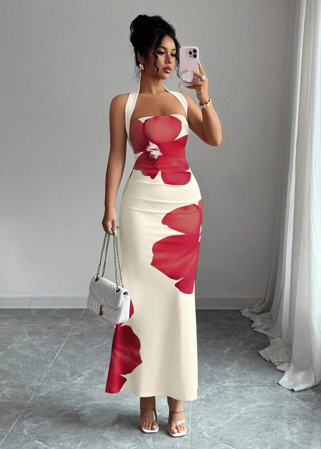 Sleeveless women's floral halter neck maxi dress, showcasing its flattering back design & flowing skirt.