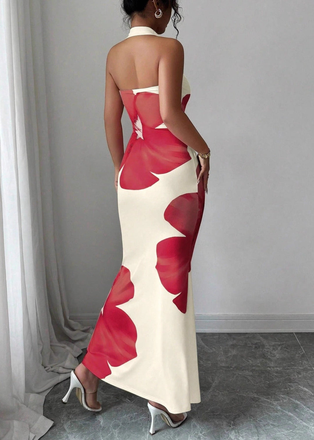 Elegant women's floral halter neck maxi dress, suitable for an evening event, beach resort, or a special summer occasion.