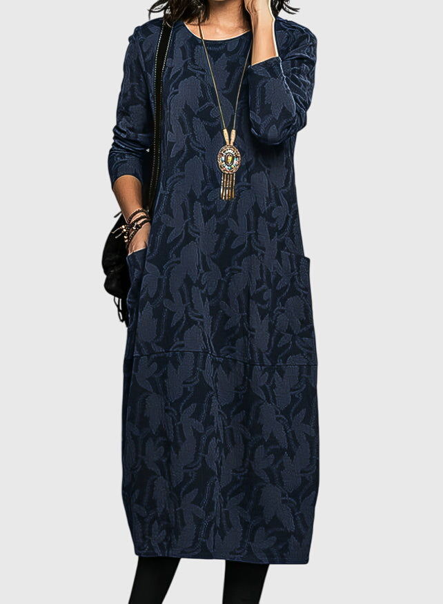 Elegant women's midi dress in floral jacquard fabric, designed with convenient pockets for everyday comfort.