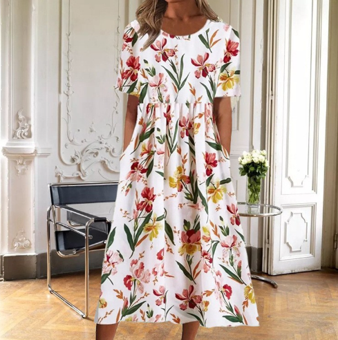 Women's floral midi dress with short sleeves, round neck, & flared skirt, perfect for summer casual wear.