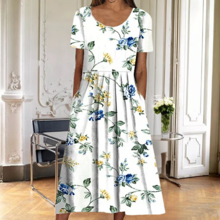 Chic women's floral midi dress with short sleeves & flowy flared hem. A versatile & elegant choice for spring-summer.