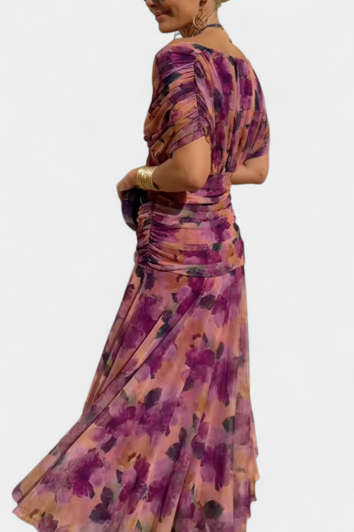 Women's floral off-shoulder maxi dress, elegant ruched sweetheart neckline, vibrant colors.