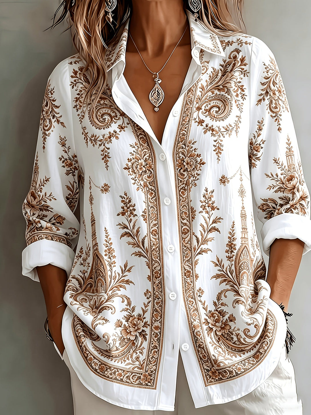 Relaxed fit women's blouse with intricate floral and paisley print, long sleeves.