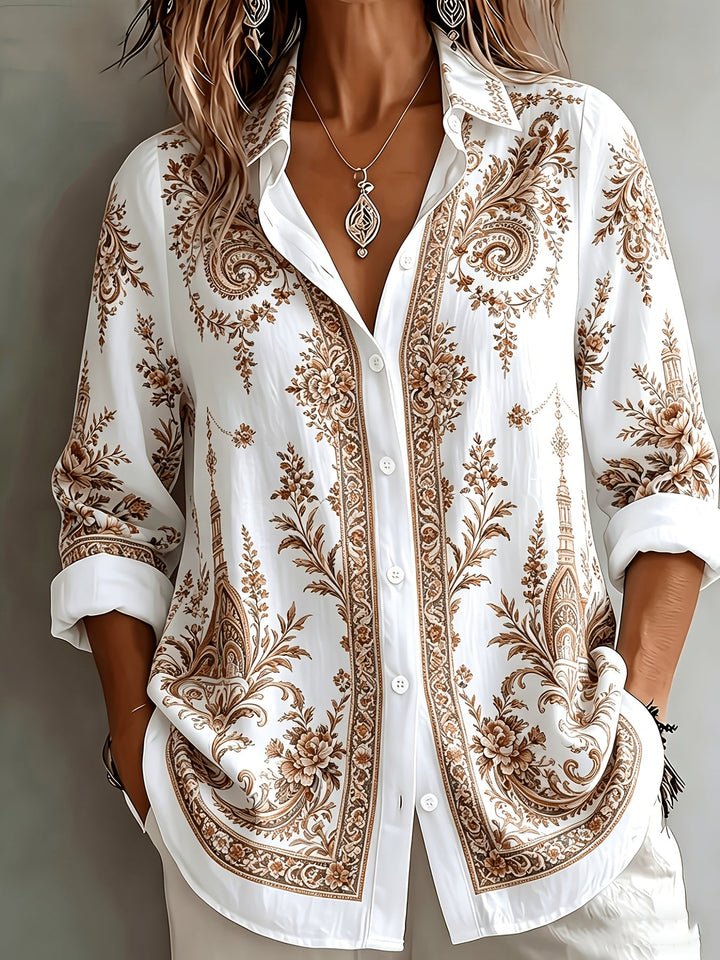 Relaxed fit women's blouse with intricate floral and paisley print, long sleeves.
