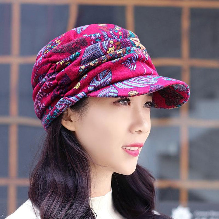 Women's floral pleated cap in a lifestyle shot, looking fashionable and warm for winter.