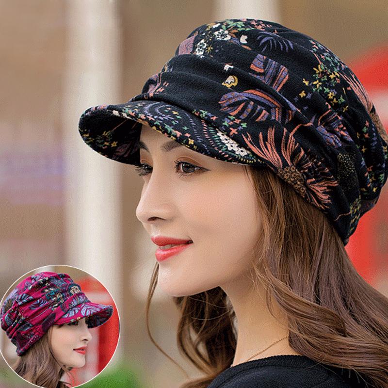 Women's floral pleated cap styled with a winter coat, showcasing its versatility as a fashion accessory.