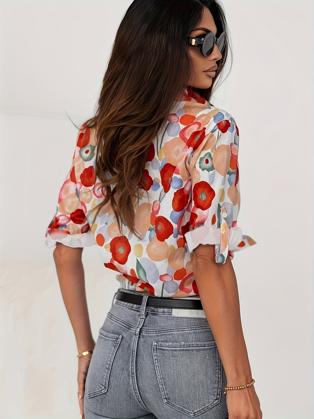Artistic floral print women's button-down blouse, long sleeve top offering effortless style for any season.