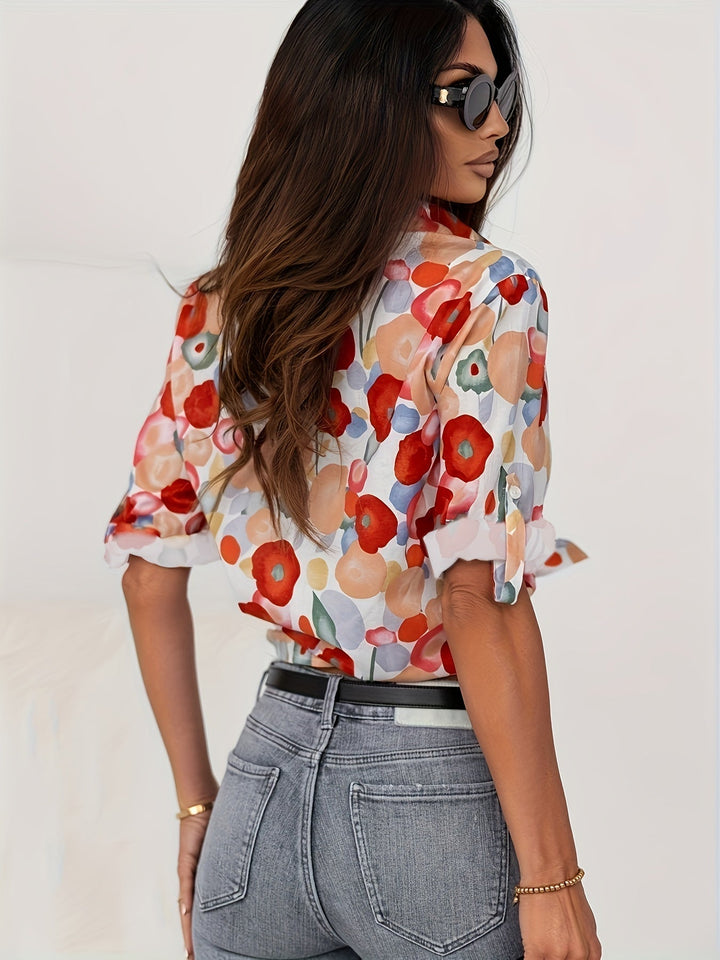 Artistic floral print women's button-down blouse, long sleeve top offering effortless style for any season.