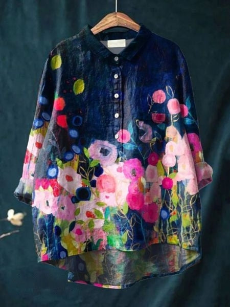 Dressy floral button-up blouse for women. Versatile everyday wear, collared top.