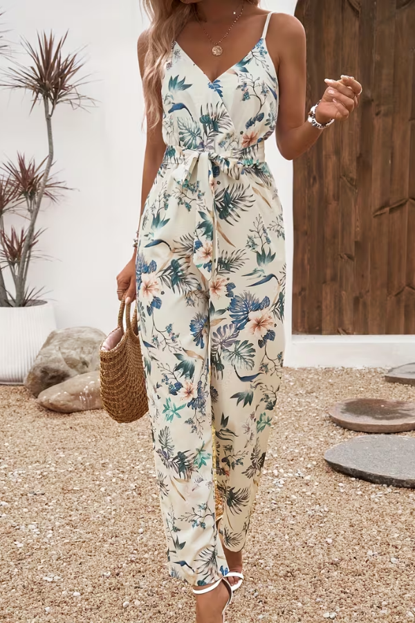 Women's floral print cami jumpsuit with tie waist. Perfect for summer casual wear or vacation.