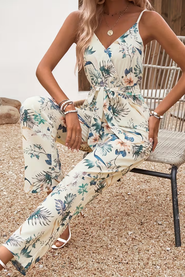 Elegant women's sleeveless floral jumpsuit. Features a stylish tie waist, ideal for summer parties.