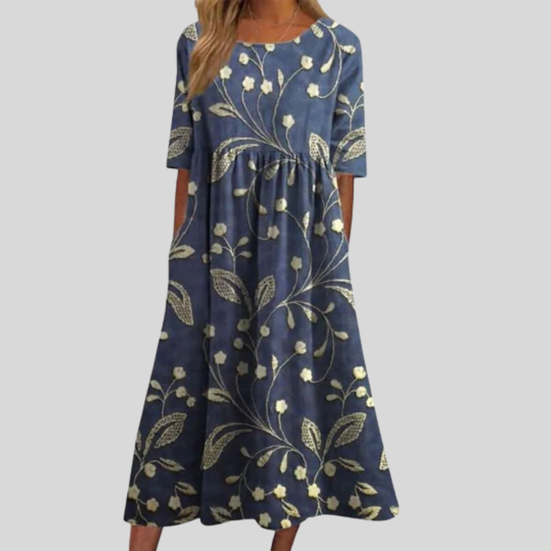 Women's floral print empire waist midi dress with pockets, perfect for spring and summer fashion.
