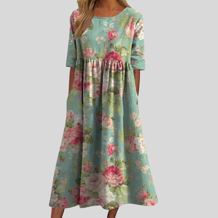 Elegant floral midi dress for women, featuring an empire waist and pockets, great for parties and events.