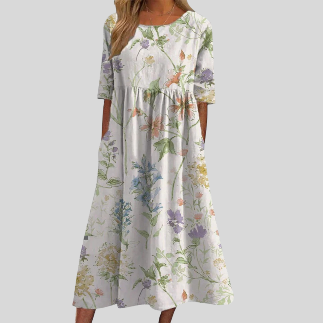 Beautiful women's floral print midi dress, empire waist silhouette, with convenient pockets for essentials.