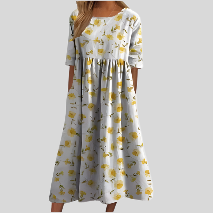Flattering empire waist floral midi dress for women, showcasing a vibrant print and practical pockets.
