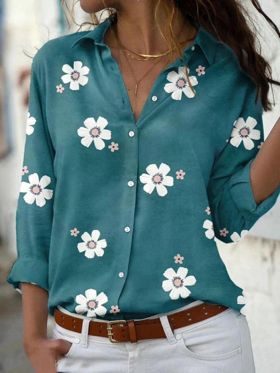 Blue floral print women's long sleeve blouse with button front. A chic and comfortable collared top for daily wear.