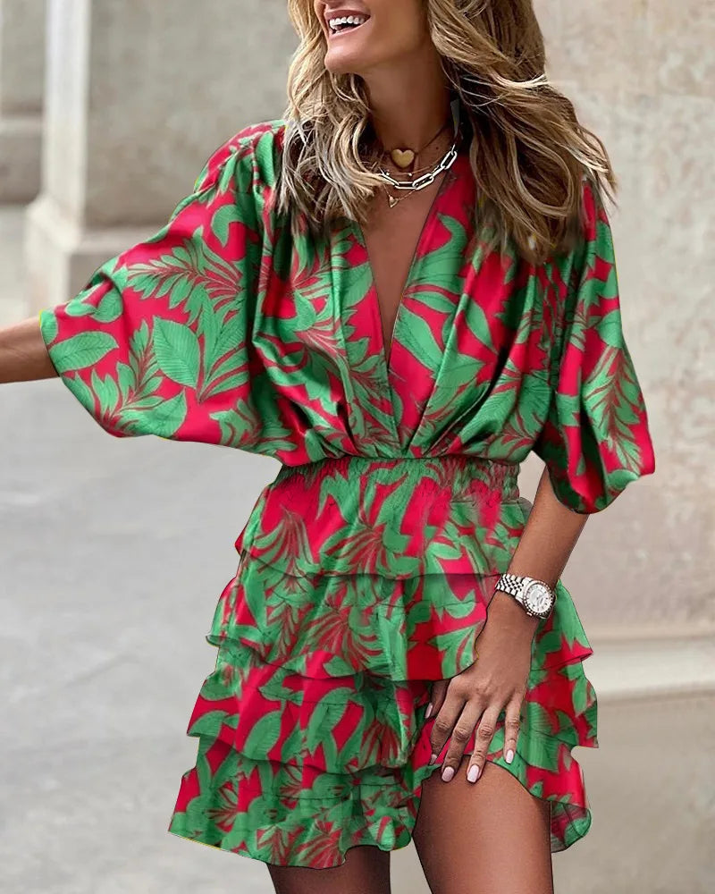 Elegant women's A-line midi dress featuring vibrant floral print and stylish ruffle tiered skirt detail.