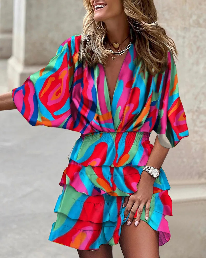 Stylish women's A-line floral wrap dress, featuring a flattering tiered ruffle design and long sleeves.