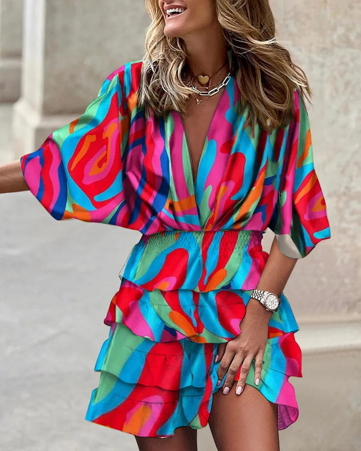 Stylish women's A-line floral wrap dress, featuring a flattering tiered ruffle design and long sleeves.