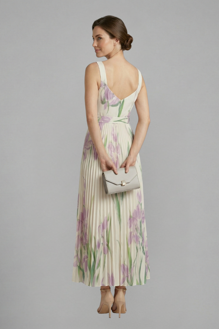 A sleeveless women's floral print maxi dress, vibrant pattern, square neck, and a stunning pleated skirt.