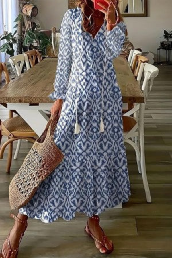 Summer women's floral maxi dress, a casual and elegant V-neck design with chic tassel embellishments for warm days.