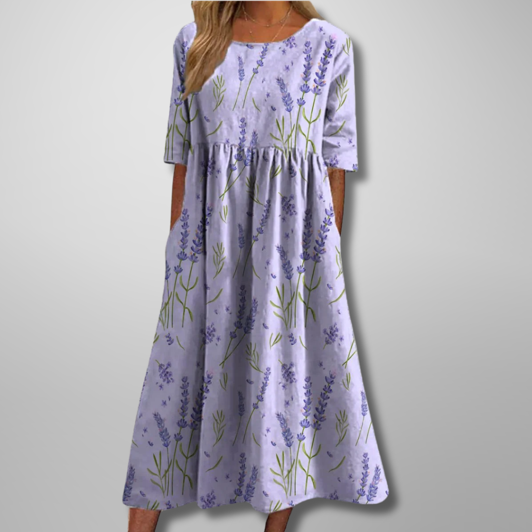 Elegant botanical print women's midi dress with a relaxed fit, short sleeves, and stylish gathered waist detail.