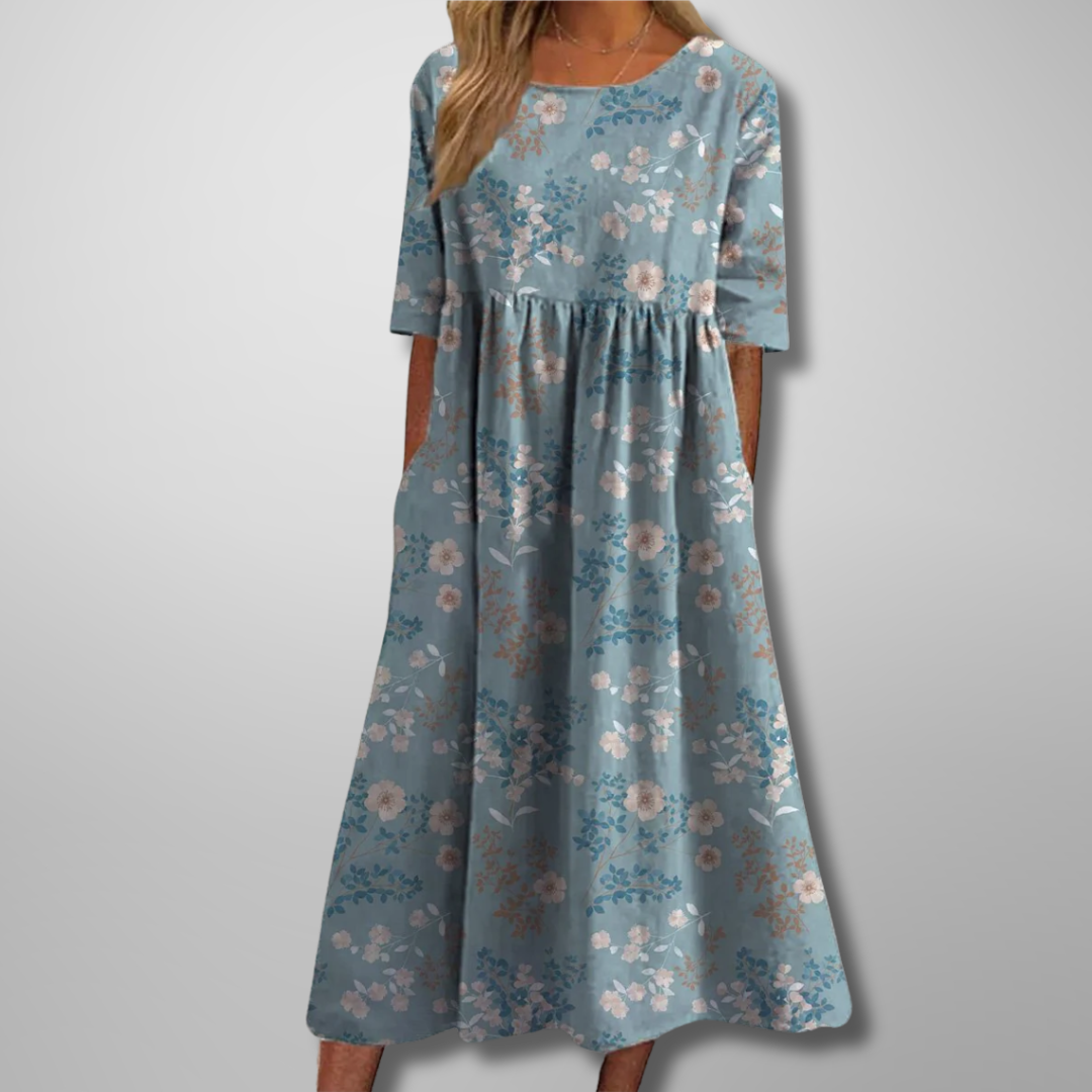 Plus size women's floral midi dress, relaxed fit, short sleeves & round neck. Comfortable for any summer occasion.