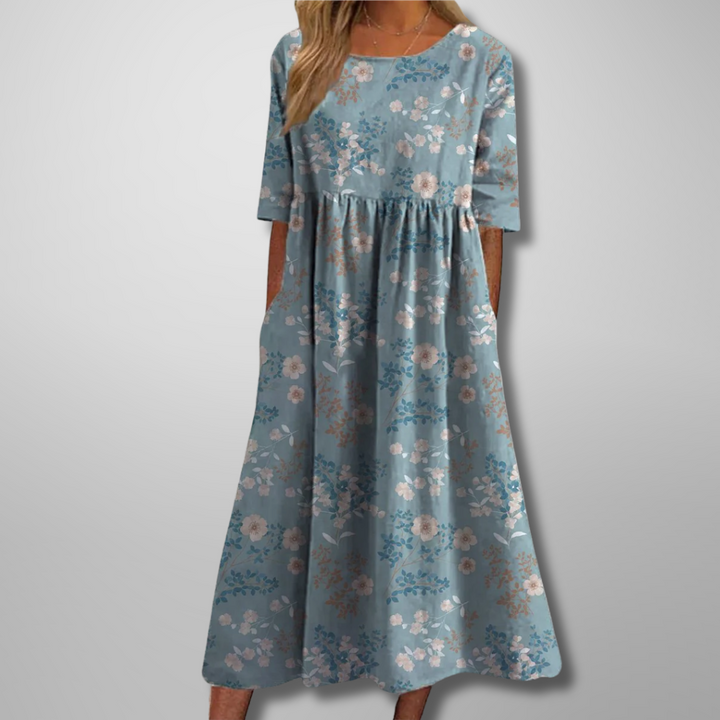 Plus size women's floral midi dress, relaxed fit, short sleeves & round neck. Comfortable for any summer occasion.
