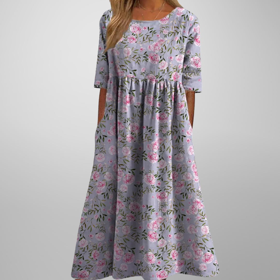 Women's short-sleeve midi dress with a delicate floral print, gathered waist, and ultra-comfortable relaxed fit.