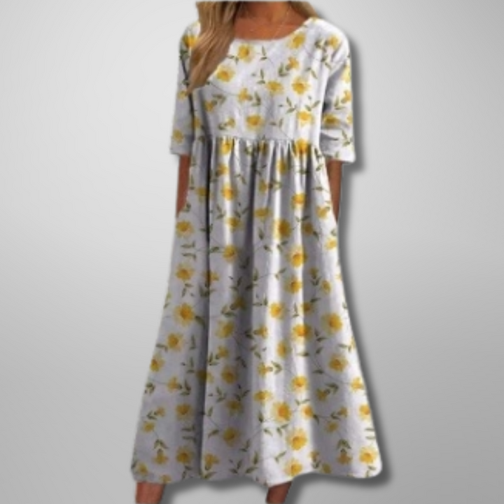 Versatile women's botanical print midi dress with short sleeves, loose fit. Ideal for casual, comfortable summer days.