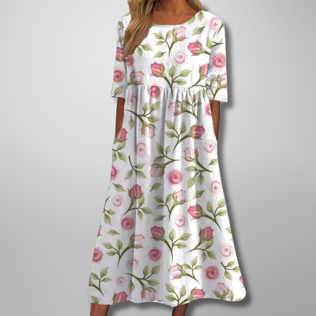 Stylish women's summer midi dress, short-sleeved, with a vibrant floral pattern and a flattering, relaxed fit.